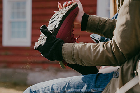 Person taking off a boot