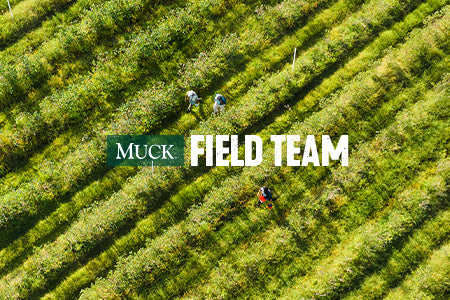 Aerial view of a hedge lined field with three people in. Text reads 'MUCK FIELD TEAM'