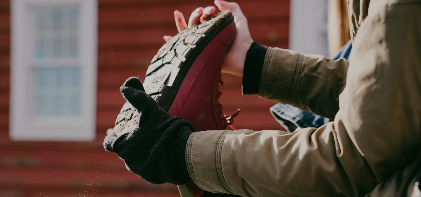 Person taking off a boot