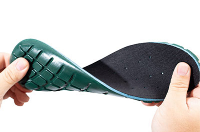 Person holding an insole