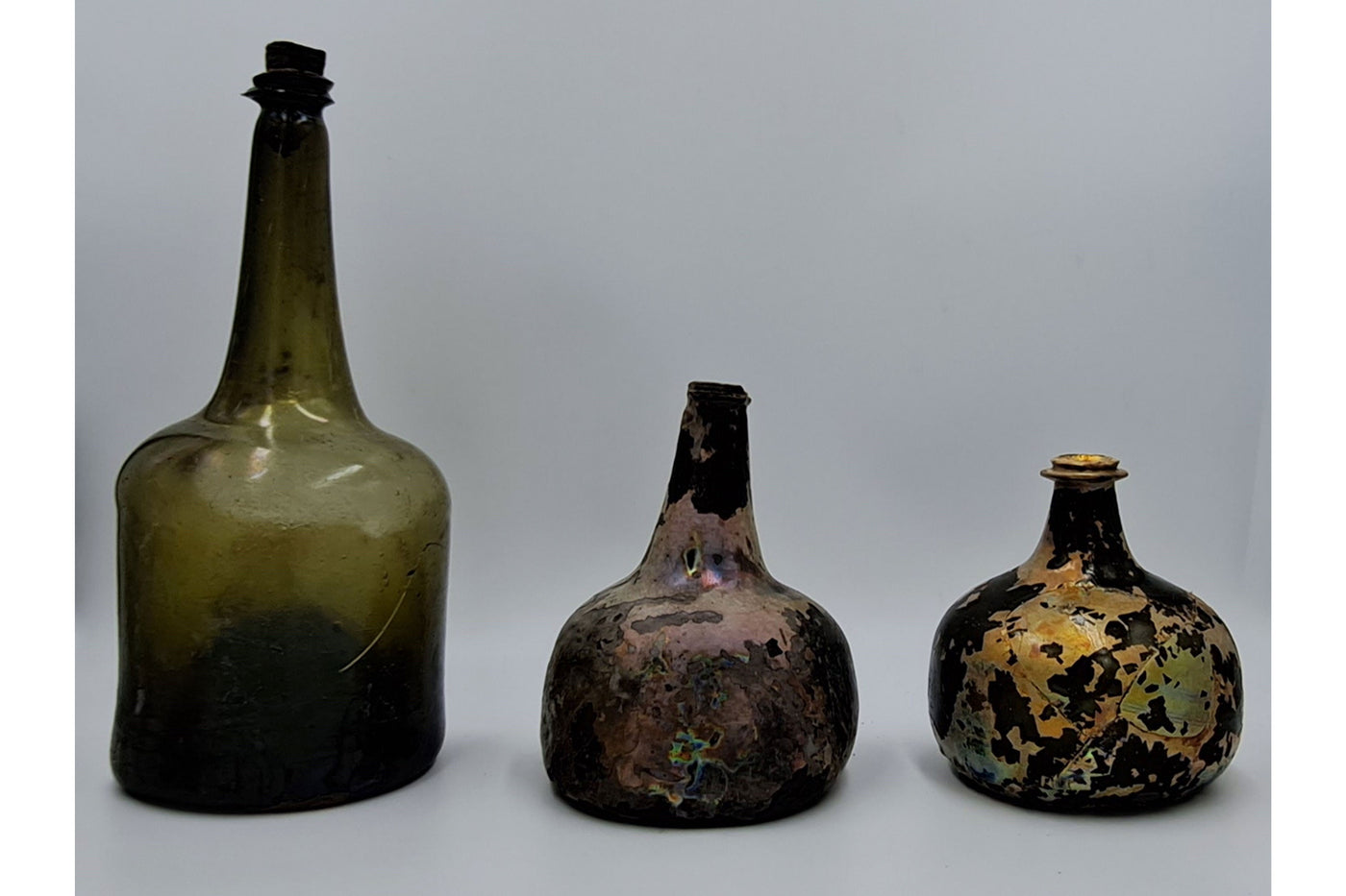 Three old bottles that Nicola White has found on the River Thames