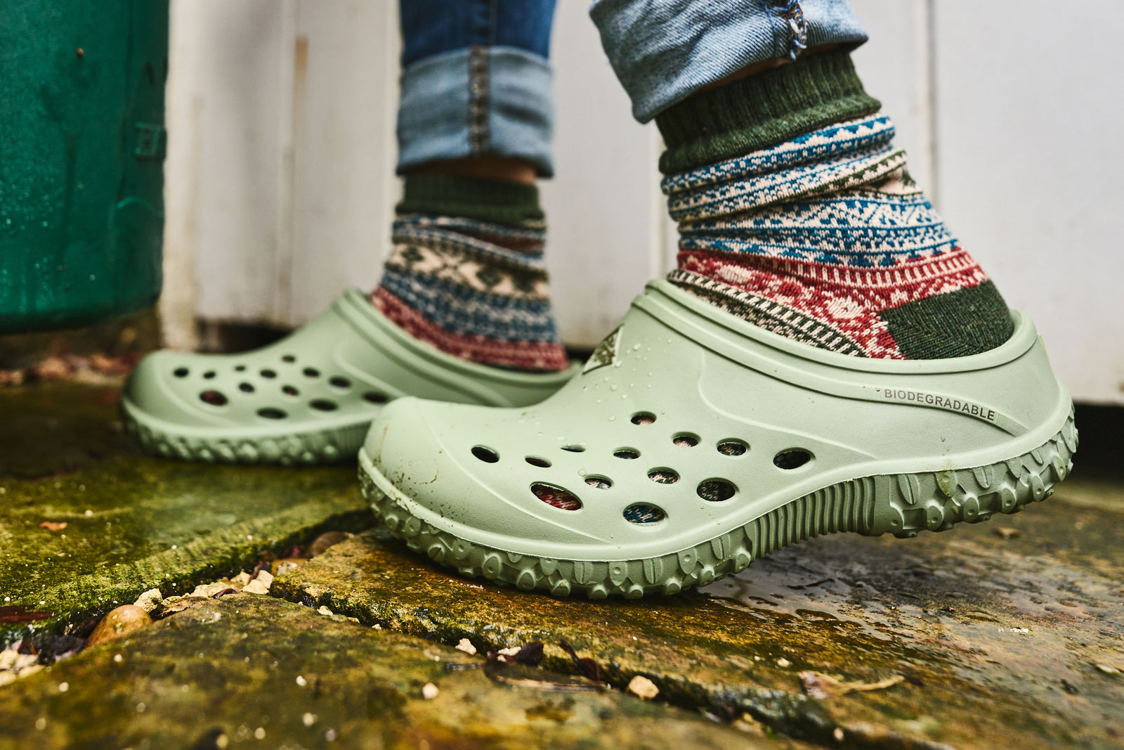 Person wearing a pair of Muck Boots Muckster Lite Clogs with thick socks