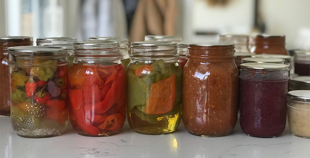 Jars of pickled peppers and jam