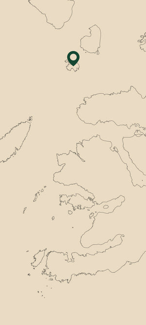 A map of Scottish islands on a beige background with a location pin over the Isle of Muck