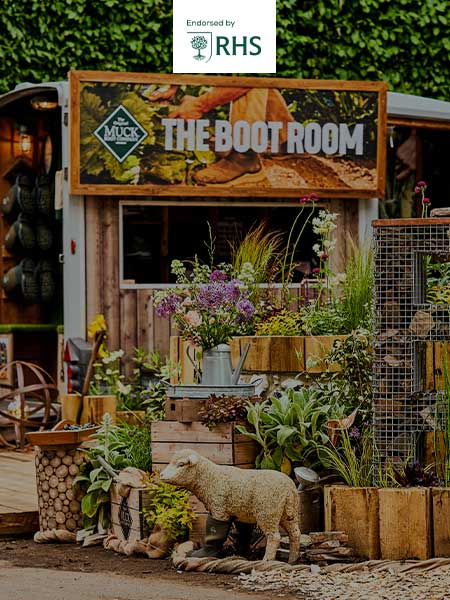 Part of the Muck Boots stand at the RHS Chelsea Flower Show and RHS logo