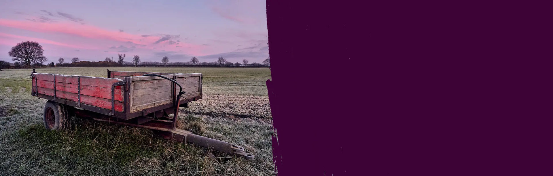 Trailer in a field with a purple sky