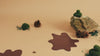 Pine cones, a rock, moss and mud props with a dull yellow background